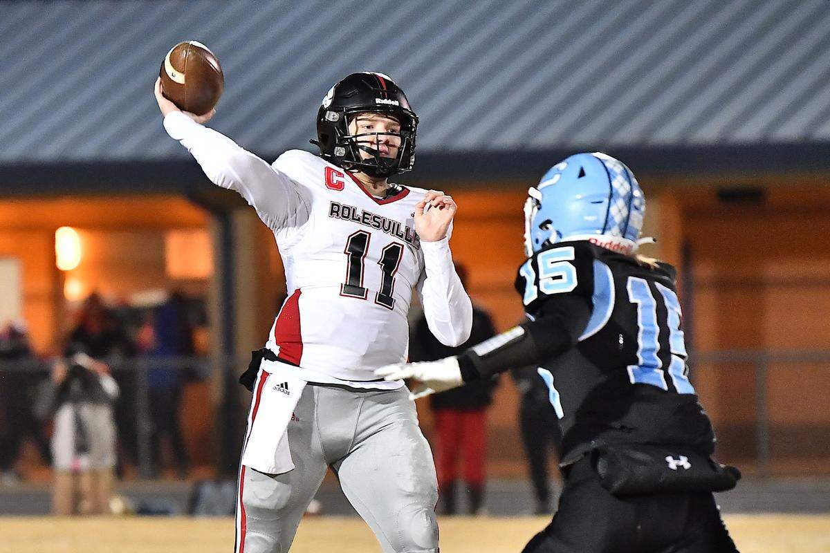 Rolesville quarterback Braden Atkinson (11) launches the pass against Cleveland’s Aiden Stephenson (15) during the first half. The Rolesville Rams and the Cleveland Rams met in the fourth round of the NCHSAA 4A football playoffs in Clayton, N.C. on December 6, 2024.