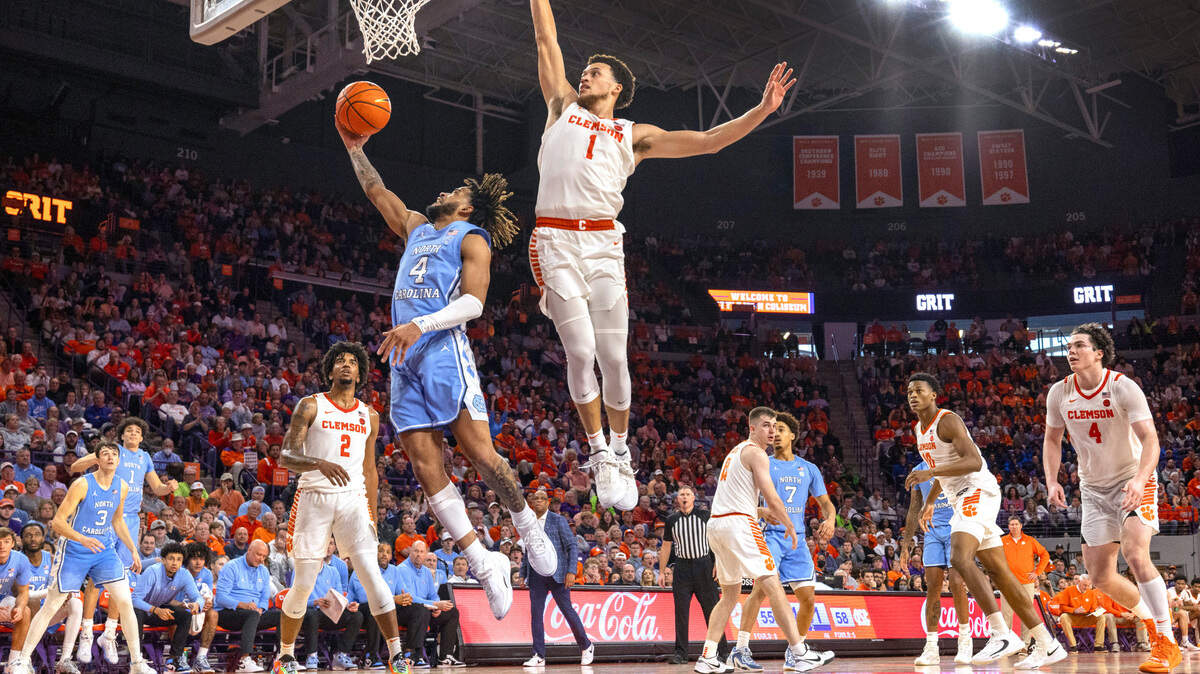 North Carolina’s R.J. Davis (4) drives to the basket against Clemson’s Chase Hunter (1) in the second half on Saturday, January 6, 2024 at Littlejohn Coliseum in Clemson, S.C. Davis scored 14 points in the Tar Heels’ 65-55 victory.