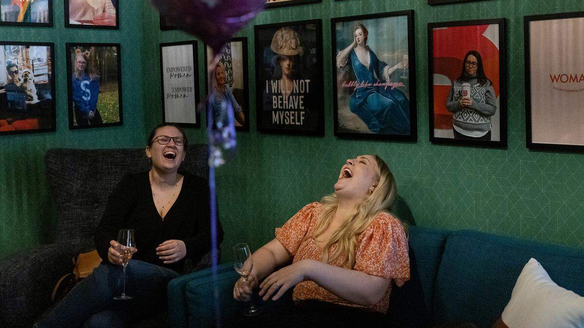 Vicki Handley Araj and Kayla Sorrell share a laugh at RBF, Your Authentic Champagne Bar on Thursday, March 16, 2023, in Cary, N.C.