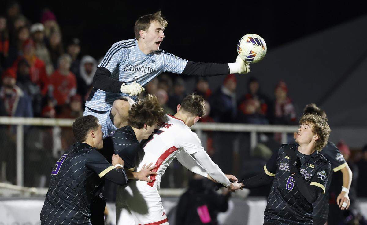 Washington's Jadon Bowton (1) knocks the ball away during Washington’s 3-2 overtime victory over N.C. State in the 2025 Men’s Soccer National Championship at WakeMed Soccer Park in Cary, N.C., Monday, Dec. 15, 2025.