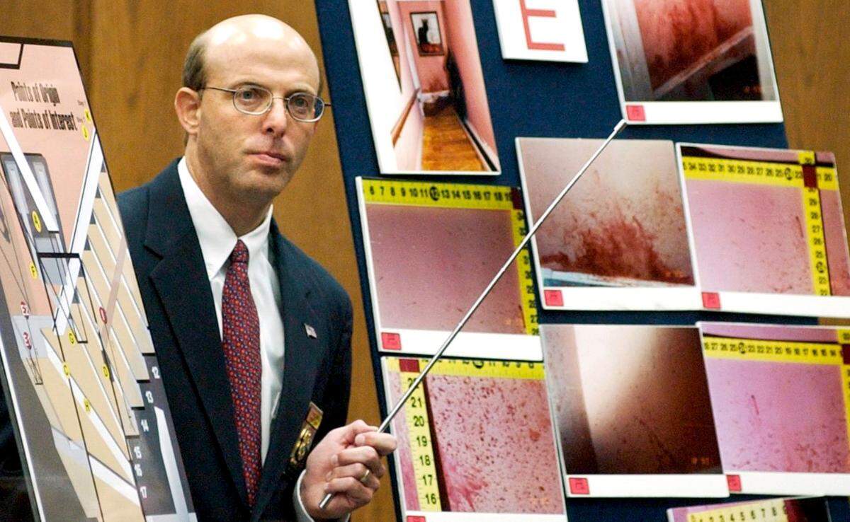State Bureau of Investigation agent Duane Deaver testifies during Michael Peterson’s murder trial in 2003. Deaver explained how his tests of blood spatters strengthened his opinion that Kathleen Peterson was beaten to death.