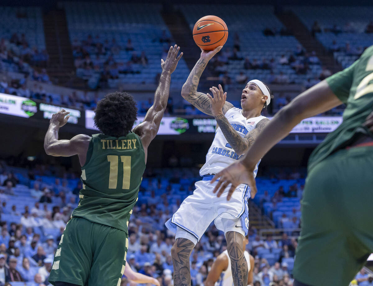 North Carolina guard Terrence Brown (1) drives to the basket against UNC Charlotte guard Keyshawn Tillery (11) in the first half on Tuesday, October 27, 2026 at the Smith Center in Chapel Hill, N.C.