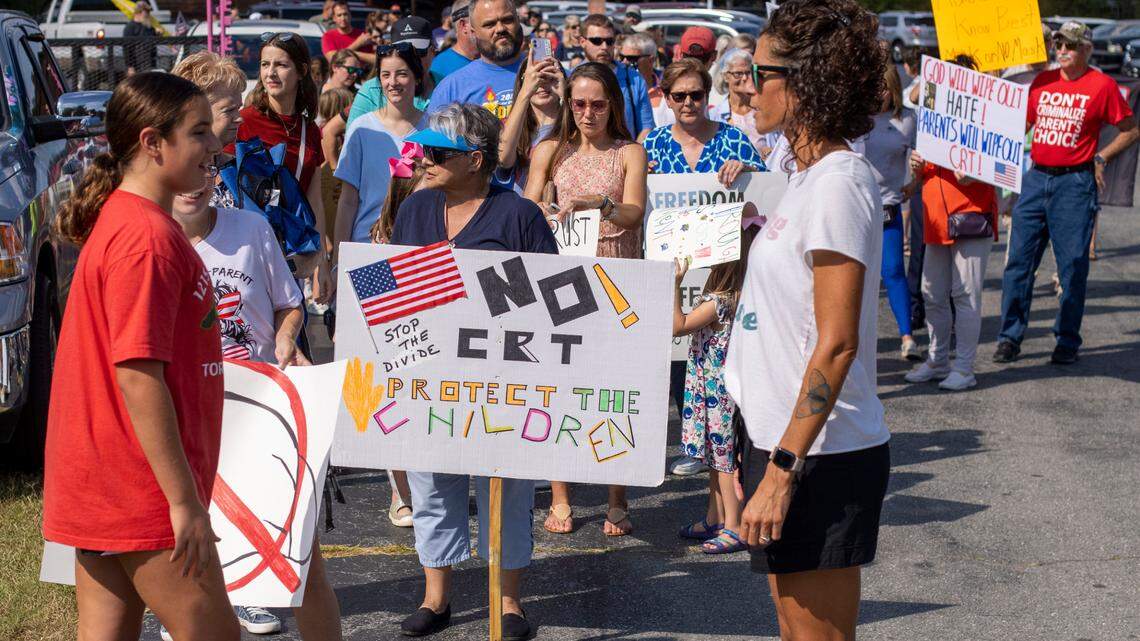 Demonstrators line up to march to the Johnston County School Board meeting to voice their opposition to a mask mandate and the teaching of critical race theory on Sept. 14, 2021 in Smithfield, N.C.
