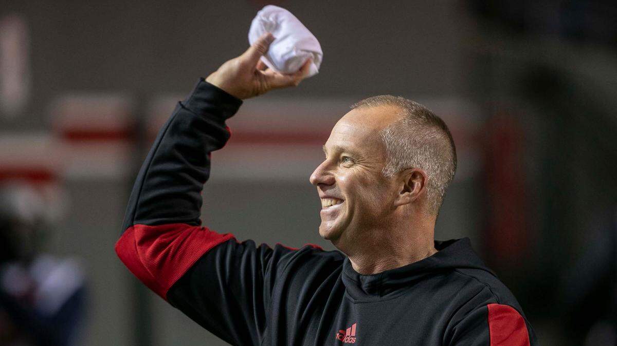N.C. State coach Dave Doeren tosses t-shirts into the student section prior to the Wolfpack’s game against North Carolina on Friday, November 26, 2021 at Carter-Finley Stadium in Raleigh, N.C.