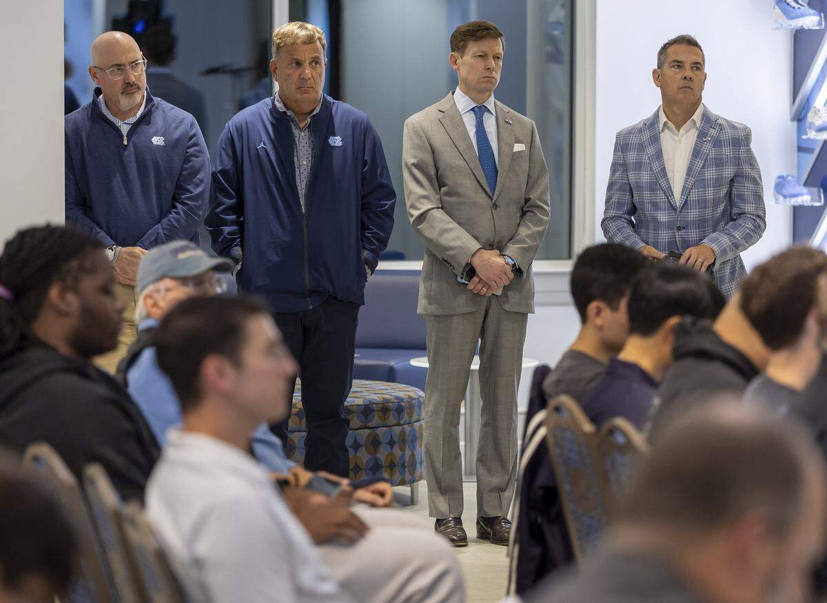 Executive Associate Athletic Director Steve Newmark, football General Manager Michael Lombardi, North Carolina Chancellor Lee Roberts and Vice Chancellor for Communications Dean Stoyer, stand together during Belichick’s press conference on Monday October 13, 2025 at Kenan Stadium in Chapel Hill, N.C.