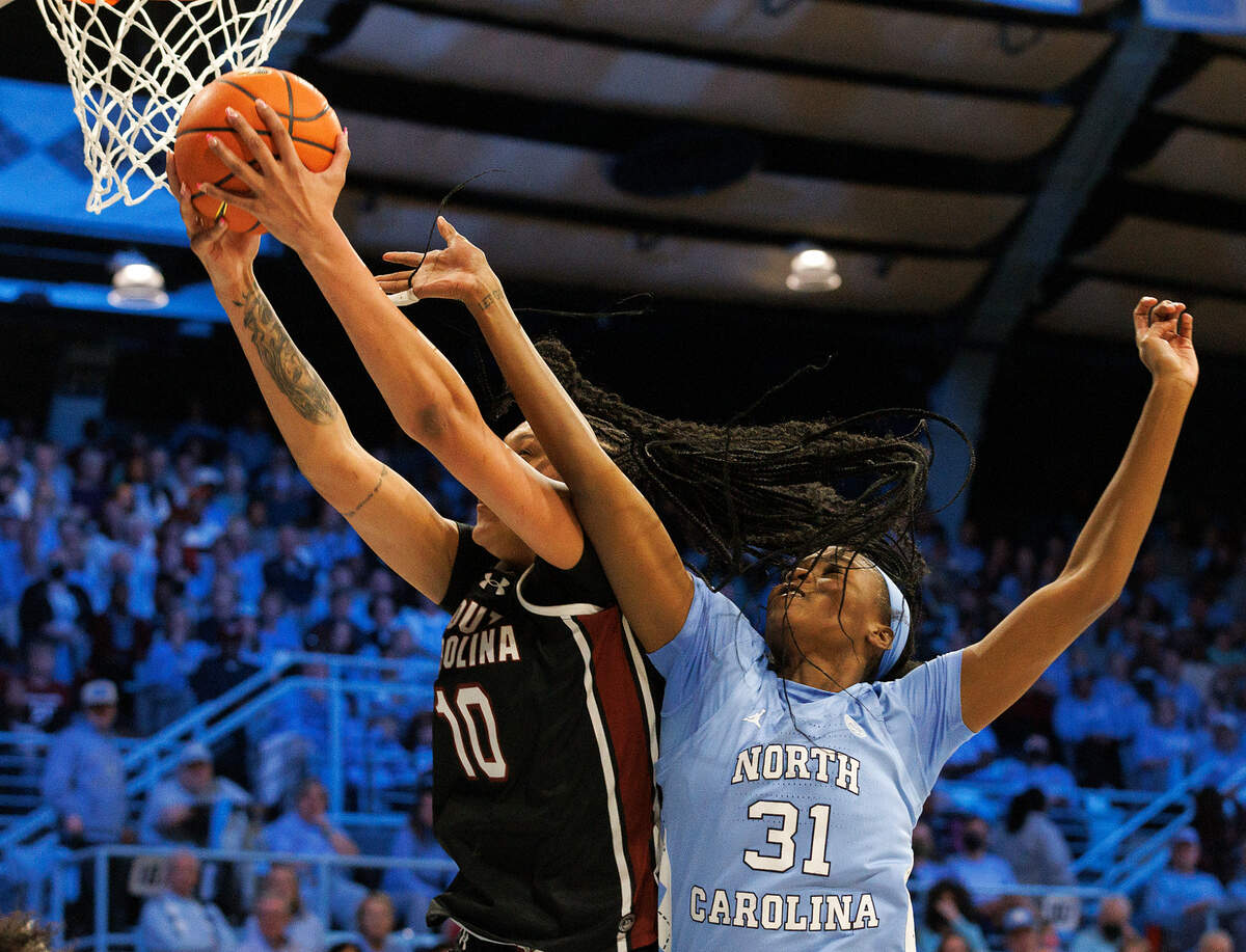 South Carolina’s Kamilla Cardoso grabs a rebound away from North Carolina’s Anya Poole during the first half of the Tar Heels’ game on Thursday, Nov. 30, 2023, at Carmichael Arena in Chapel Hill, N.C.