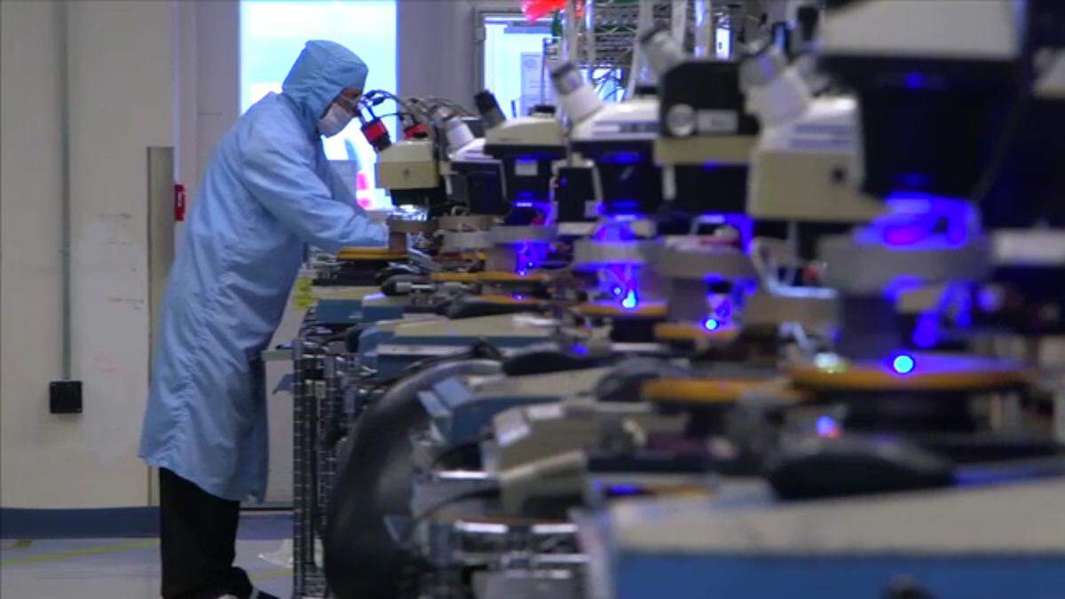 A technician looks over chips manufactured by Cree Inc.’s Wolfspeed subsidary.