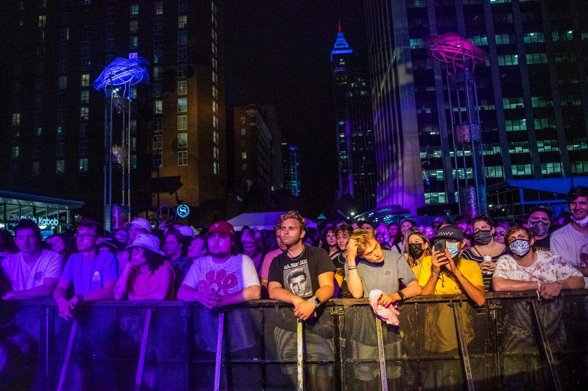 Concert-goers listen to Animal Collective at City Plaza in Raleigh during the third day of the Hopscotch Music Festival Saturday, Sept. 11, 2021.