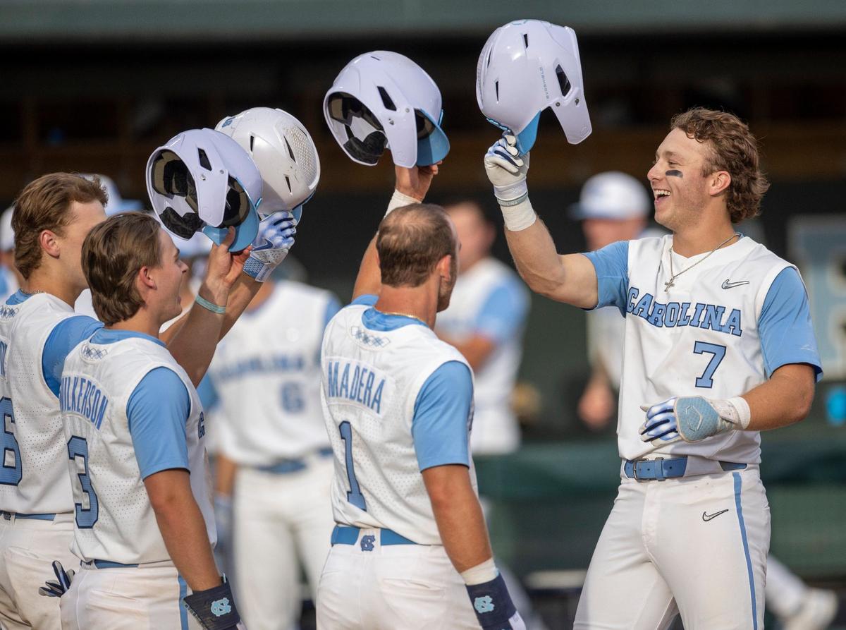 North Carolina’s Vance Honeycutt (7) celebrates with teammates Colby Wilkerson (3) and Alex Madera (1) after connecting for a 3 RBI home run in the fifth inning to give the Tar Heels a 3-0 lead against LSU during the NCAA Regional on Saturday, June 1, 2024 at Boshamer Stadium in Chapel Hill, N.C.