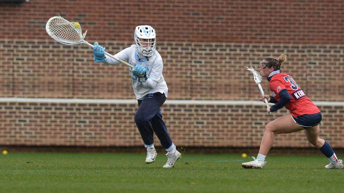 Goalie Taylor Moreno of the University of North Carolina Women’s Lacrosse team runs with the ball during a game against Stony Brook earlier this season.
