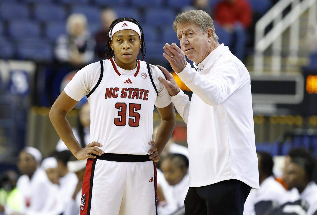 N.C. State head coach Wes Moore talks with Zoe Brooks (35) during the first half of N.C. State’s exhibition game against Maryland at the First Horizon Coliseum in Greensboro, N.C., Sunday Oct. 26, 2025.