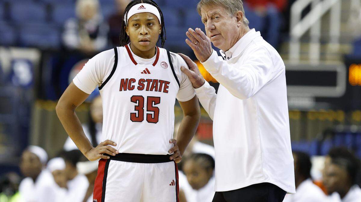 N.C. State head coach Wes Moore talks with Zoe Brooks (35) during the first half of N.C. State’s exhibition game against Maryland at the First Horizon Coliseum in Greensboro, N.C., Sunday Oct. 26, 2025.