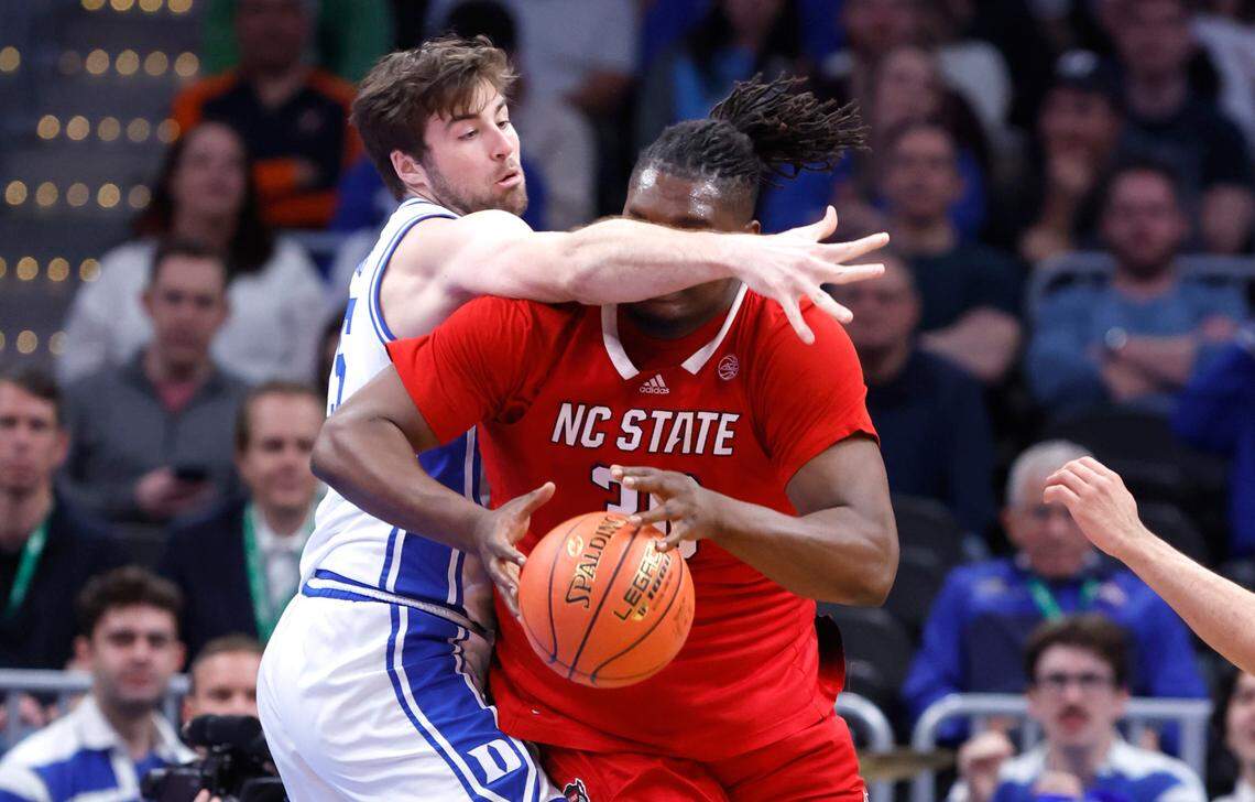 Duke’s Ryan Young (15) defends N.C. State’s DJ Burns Jr. (30) during the first half of N.C. State’s game against Duke in the quarterfinal round of the 2024 ACC Men’s Basketball Tournament at Capital One Arena in Washington, D.C., Thursday, March 14, 2024.