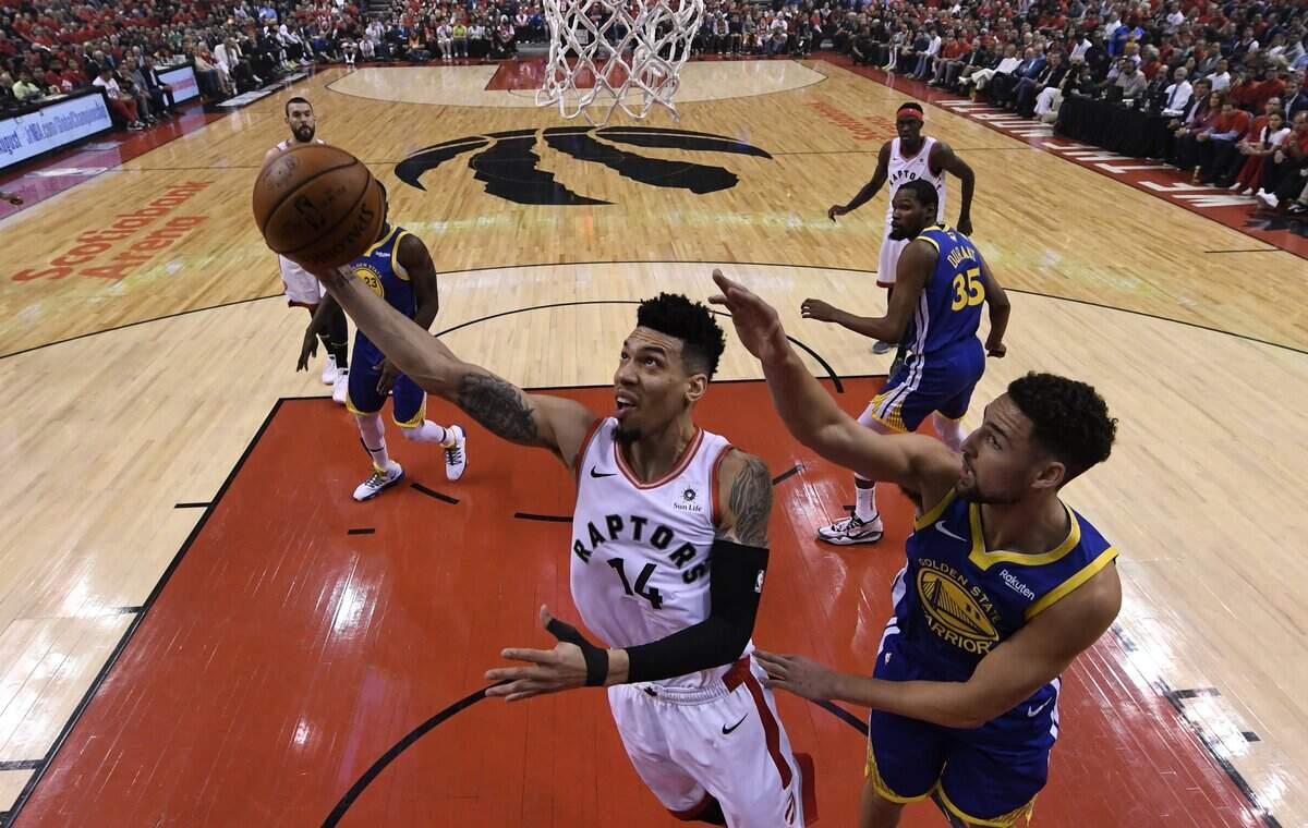Toronto Raptors guard Danny Green (14) shoots past Golden State Warriors guard Klay Thompson (11) during Game 5 of the NBA Finals on June 10.
