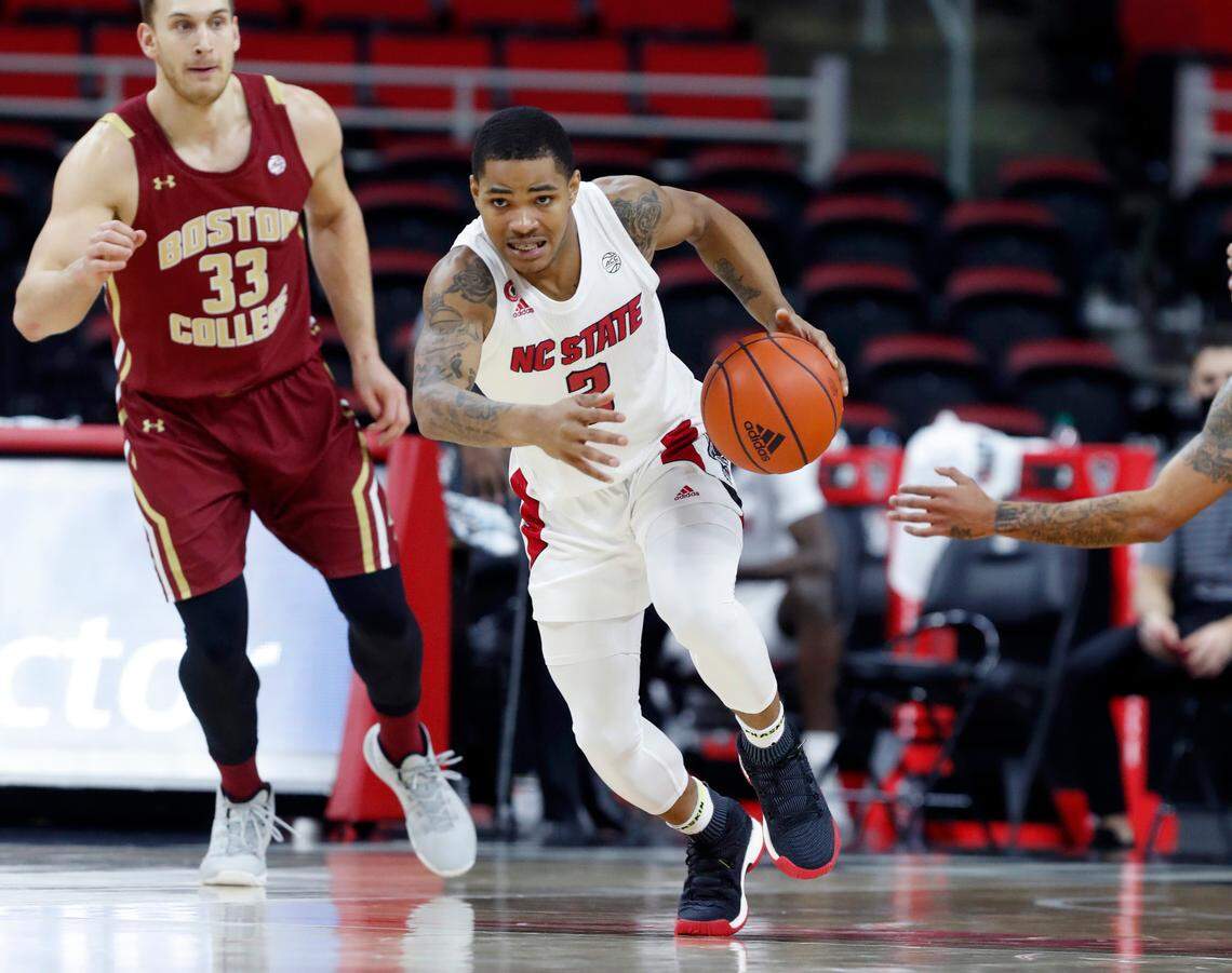 N.C. State’s Shakeel Moore (2) brings the ball up court during the first half of N.C. State’s game against Boston College at PNC Arena in Raleigh, N.C., Wednesday, December 30, 2020.