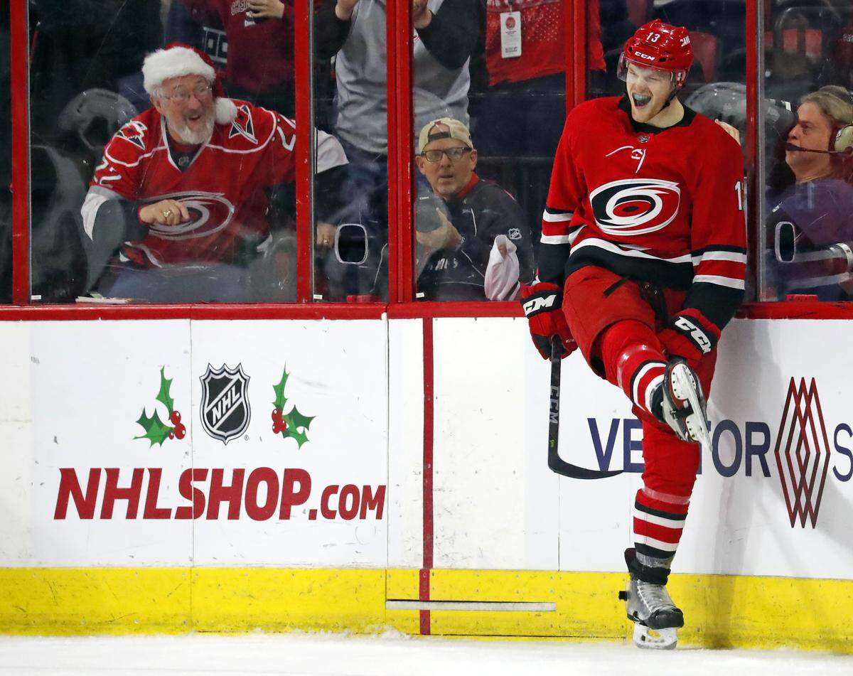 Carolina Hurricanes’ Warren Foegele (13) celebrates his goal against the Arizona Coyotes during the second period of an NHL hockey game, Sunday, Dec. 16, 2018, in Raleigh, N.C. (AP Photo/Karl B DeBlaker)