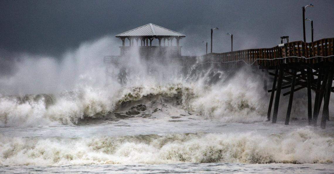 Waves slam the Oceana Pier & Pier House Restaurant in Atlantic Beach Thursday, Sept. 13, 2018 as Hurricane Florence approaches the Carolinas.