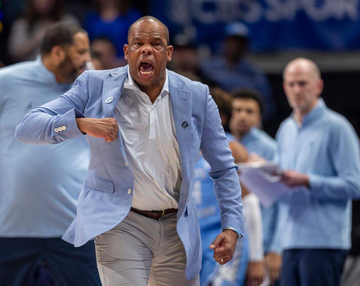 North Carolina coach Hubert Davis reacts after a technical foul on Paxson Wojcik (8) during the first half against Kentucky on Saturday, December 16, 2023 at State Farm Arena in Atlanta, Georgia.