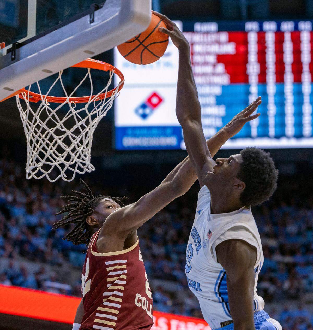 North Carolina forward Drake Powell (9) drives to the basket for a dunk over Boston College’s Jayden Hastings (22) in the first half on Saturday, January 25, 2025 at the Smith Center in Chapel Hill, N.C.