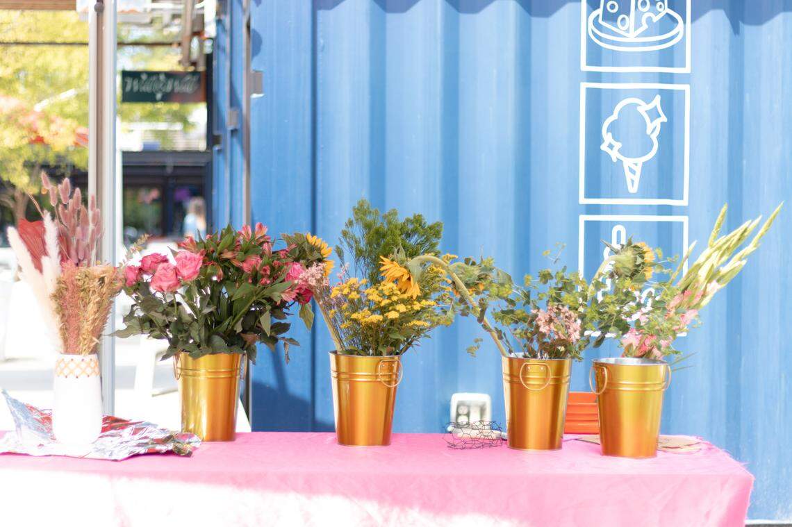 Visitors at 1 Blossom 2 Bloom, a new florist shop at Boxyard RTP, can shop floral arrangements and participate in workshops.