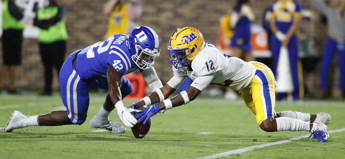 Duke linebacker Shaka Heyward (42) scoops up a botched punt catch by Pittsburgh’s Paris Ford (12) during the second half of Pittsburgh’s 33-30 victory over Duke at Wallace Wade Stadium in Durham, N.C., Saturday, Oct. 5, 2019.