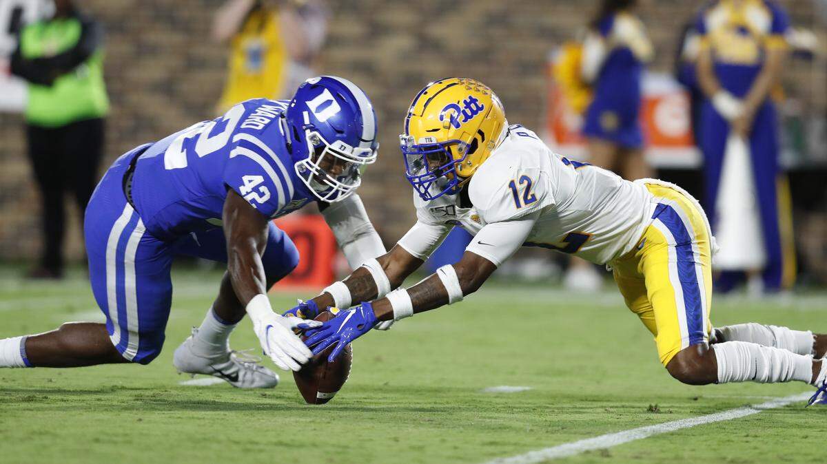 Duke linebacker Shaka Heyward (42) scoops up a botched punt catch by Pittsburgh’s Paris Ford (12) during the second half of Pittsburgh’s 33-30 victory over Duke at Wallace Wade Stadium in Durham, N.C., Saturday, Oct. 5, 2019.