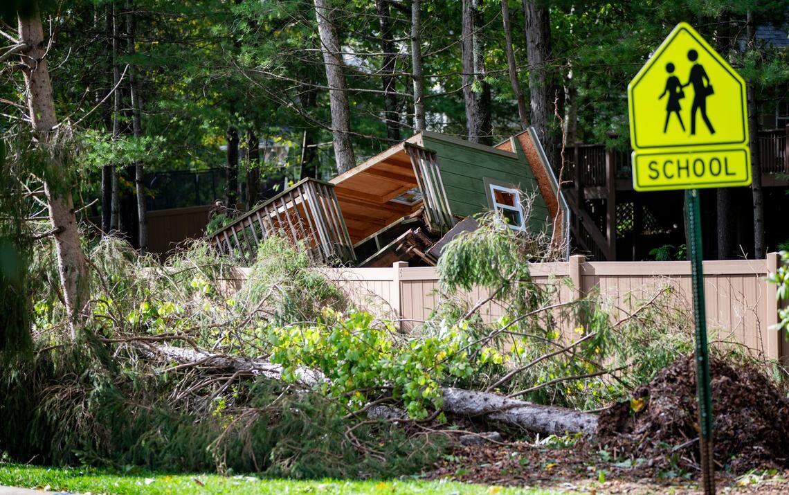 A shed sits toppled over on Pinchot Road in Arden Friday afternoon after Hurricane Helene passed through the Asheville area the night before.