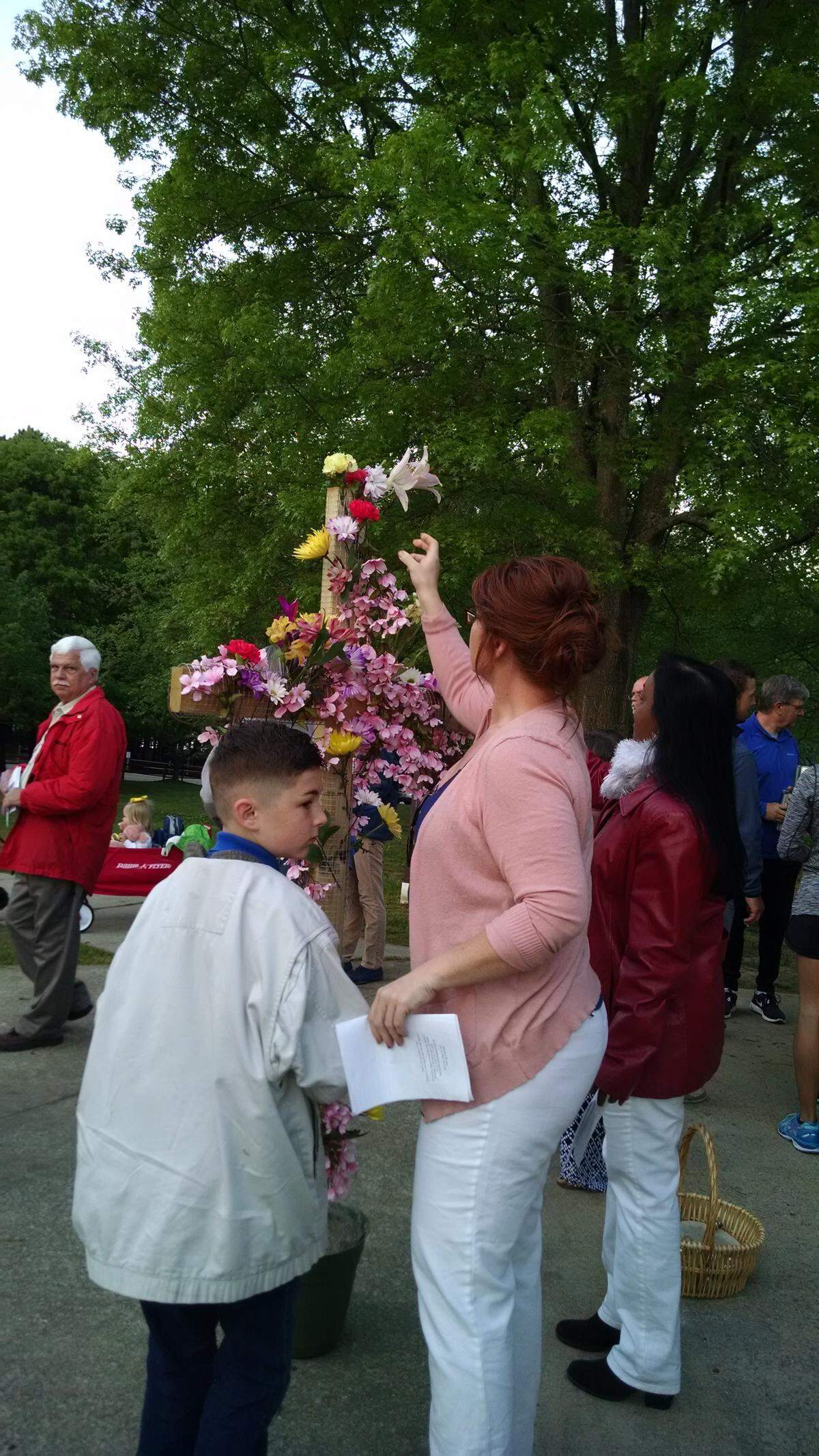 At the Garner Community Easter Sunrise Service, a cross will be flowered. Participants may bring their own flowers or choose from what the church provides. This year's service is April 1 at Lake Benson Park.
