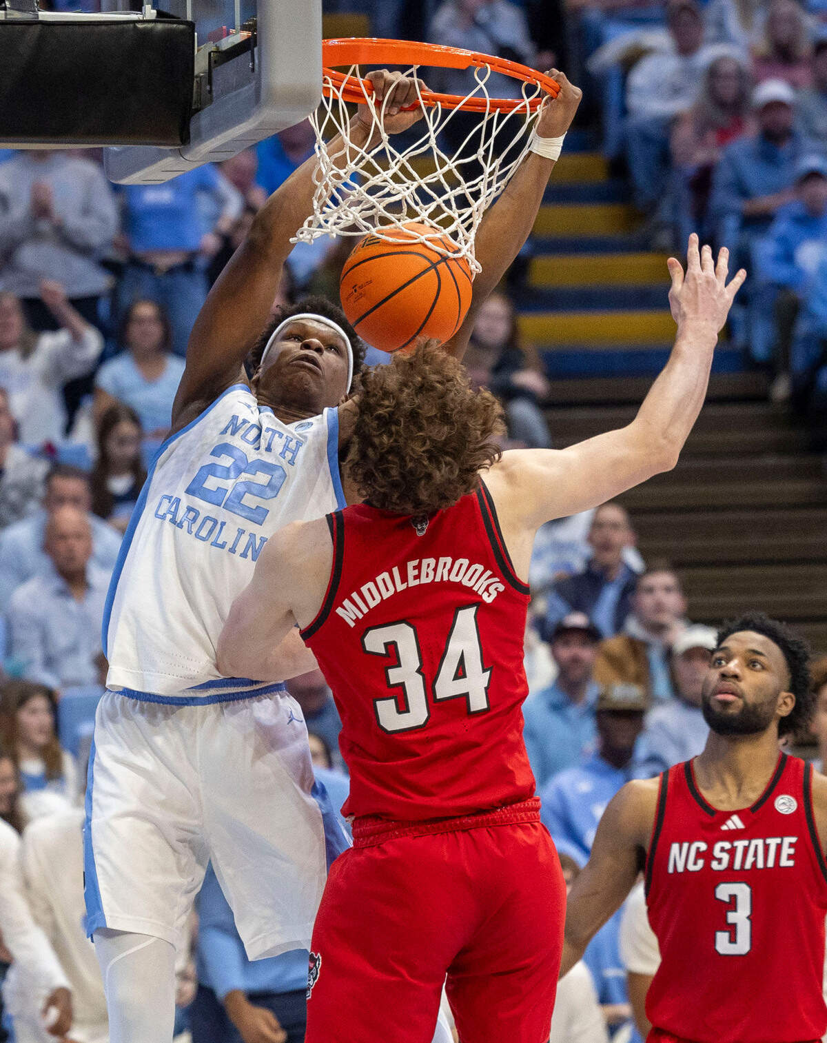 North Carolina forward Ven-Allen Lubin (22) dunks over N.C. State’s Ben Middlebrooks (34) in the second half on Wednesday, February 19, 2025 in Chapel Hill, N.C.