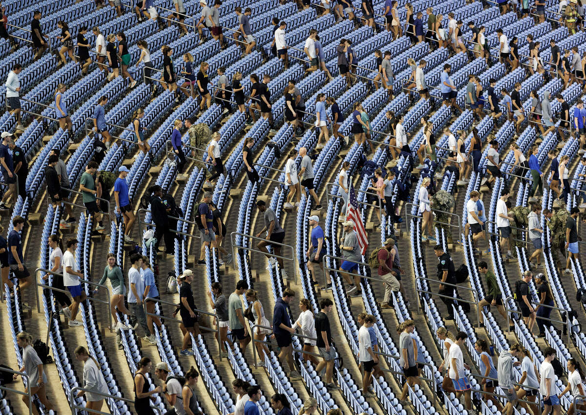 Participants climb the stairs of Kenan Memorial Stadium during an event in Chapel Hill, N.C. on Thursday, Sept. 11, 2025, to honor those who lost their lives during the attacks of Sept. 11, 2001.