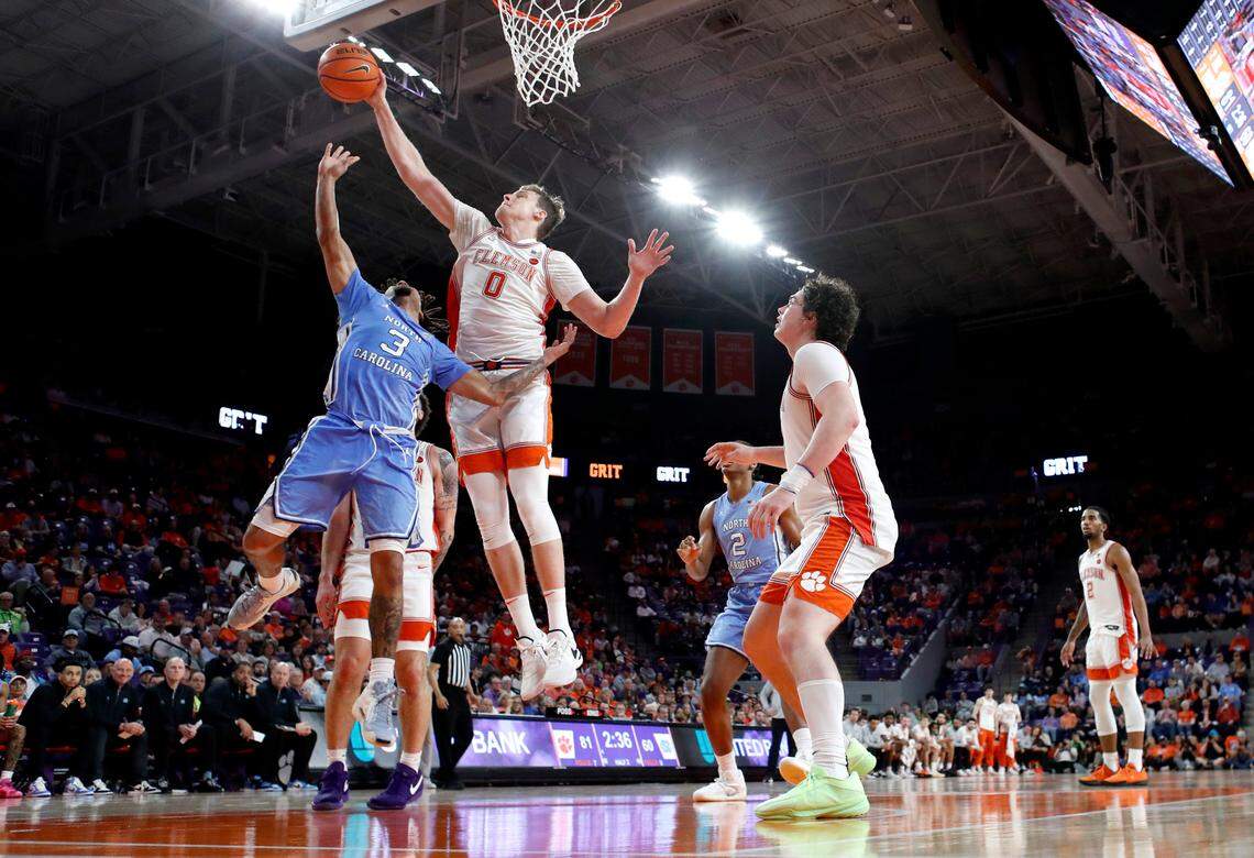Clemson’s Viktor Lakhin (0) blocks the shot by North Carolina’s Elliot Cadeau (3) in the second half during Clemson’s 85-65 victory over UNC at Littlejohn Coliseum in Clemson, S.C., Monday, Feb. 10, 2025.