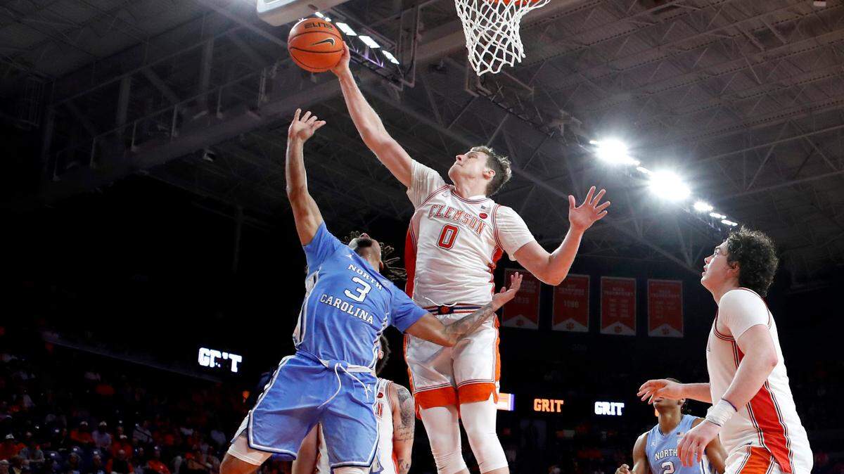 Clemson’s Viktor Lakhin (0) blocks the shot by North Carolina’s Elliot Cadeau (3) in the second half during Clemson’s 85-65 victory over UNC at Littlejohn Coliseum in Clemson, S.C., Monday, Feb. 10, 2025.