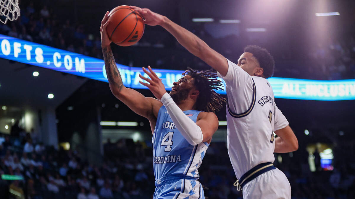 Jan 30, 2024; Atlanta, Georgia, USA; Georgia Tech Yellow Jackets guard Kyle Sturdivant (1) blocks the shot of North Carolina Tar Heels guard RJ Davis (4) in the first half at McCamish Pavilion.