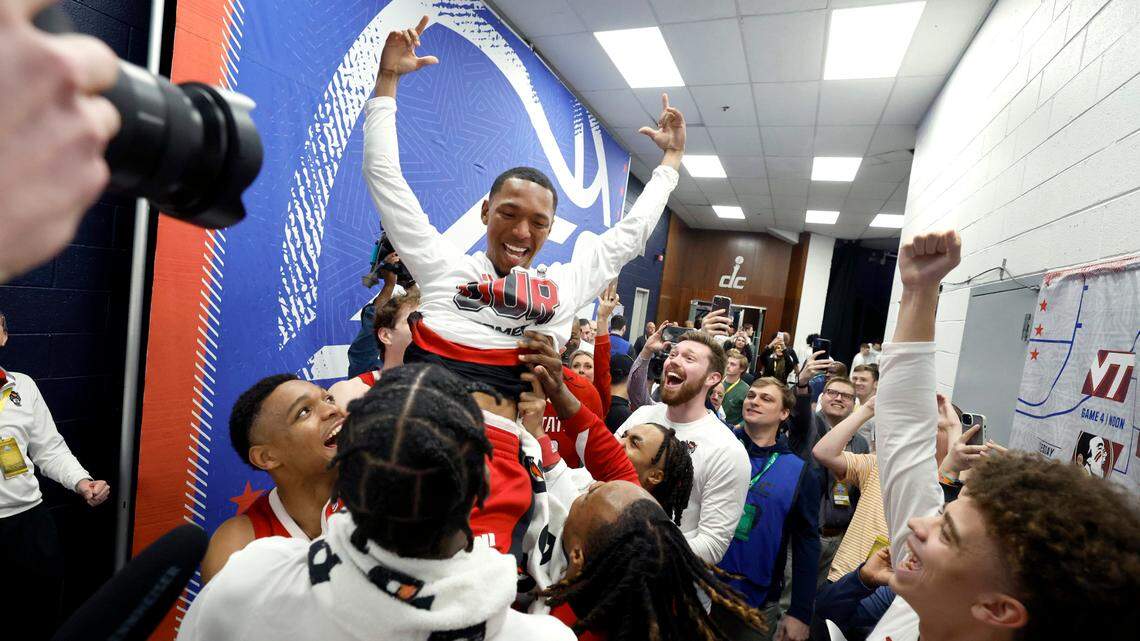 N.C. State’s KJ Keatts (13) is lifted up after placing the Wolfpack sticker on the board after N.C. State’s 74-69 victory over Duke in the quarterfinal round of the 2024 ACC Men’s Basketball Tournament at Capital One Arena in Washington, D.C., Thursday, March 14, 2024.