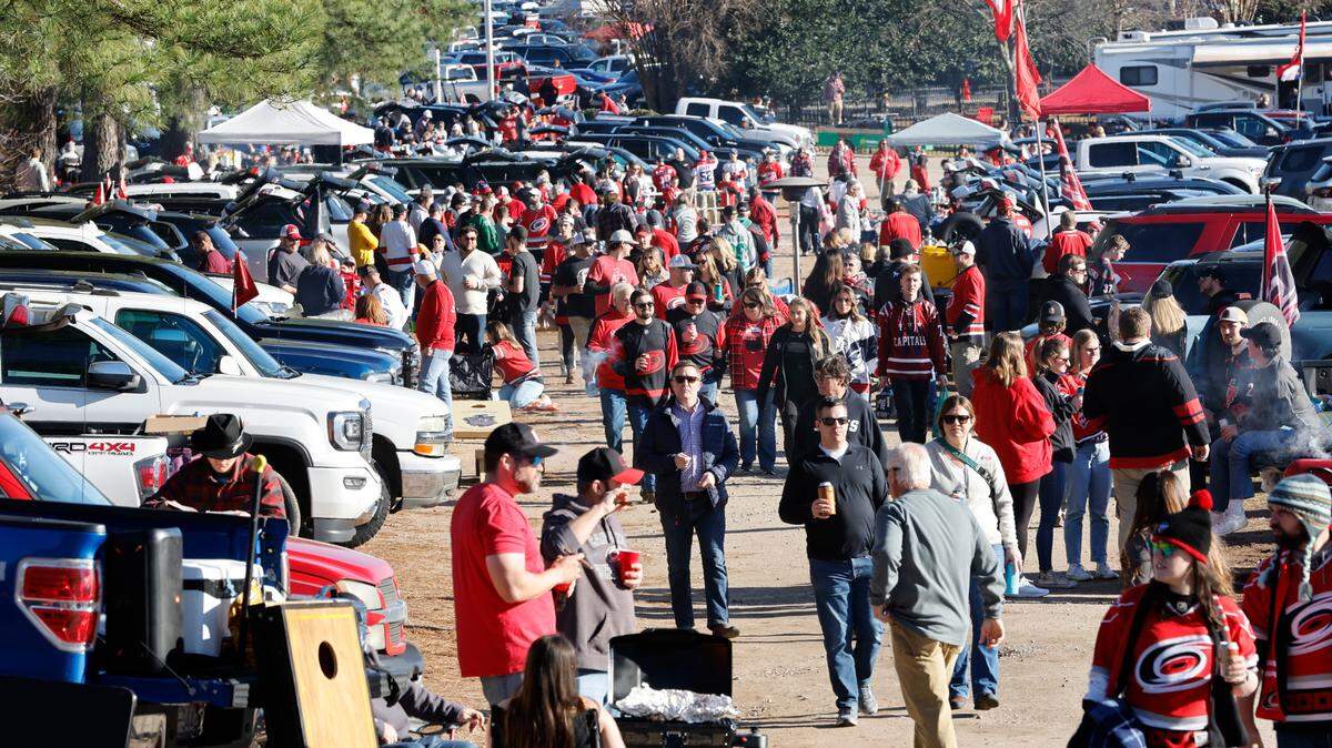 Fans tailgate before the NHL Stadium Series game between the Carolina Hurricanes and the Washington Capitals at Carter-Finley Stadium in Raleigh, N.C., Saturday, Feb. 18, 2023.