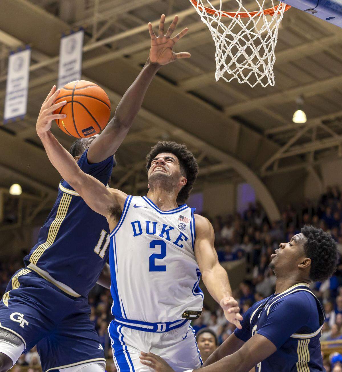 Duke guard Cayden Boozer (2) drives to the basket against Georgia Tech forward Baye Ndongo (11) in the first half on Wednesday, December 31, 2025 at Cameron Indoor Stadium in Durham, N.C.