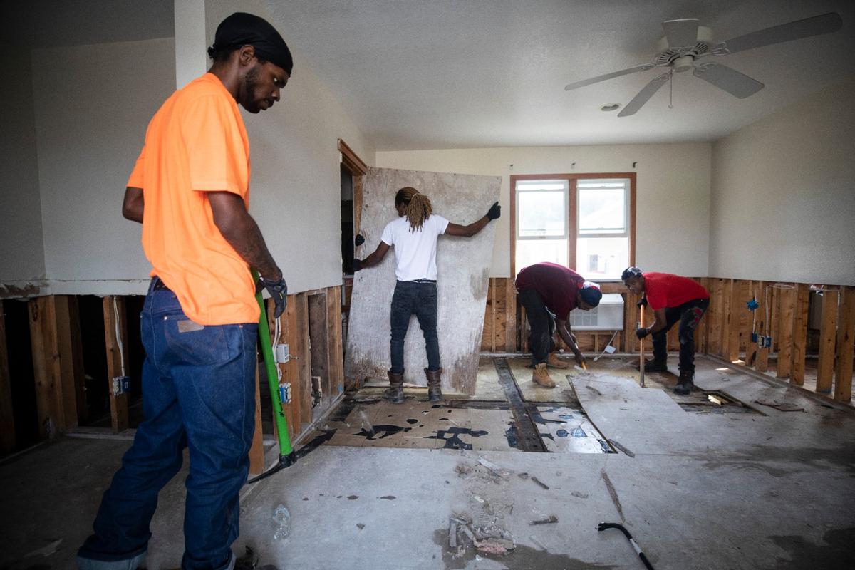 Servpro employees rip up floors on the first floor of the Pony Island Motel on Friday, Sept. 13, 2019, which was flooded by Hurricane Dorians storm surge last Thursday.