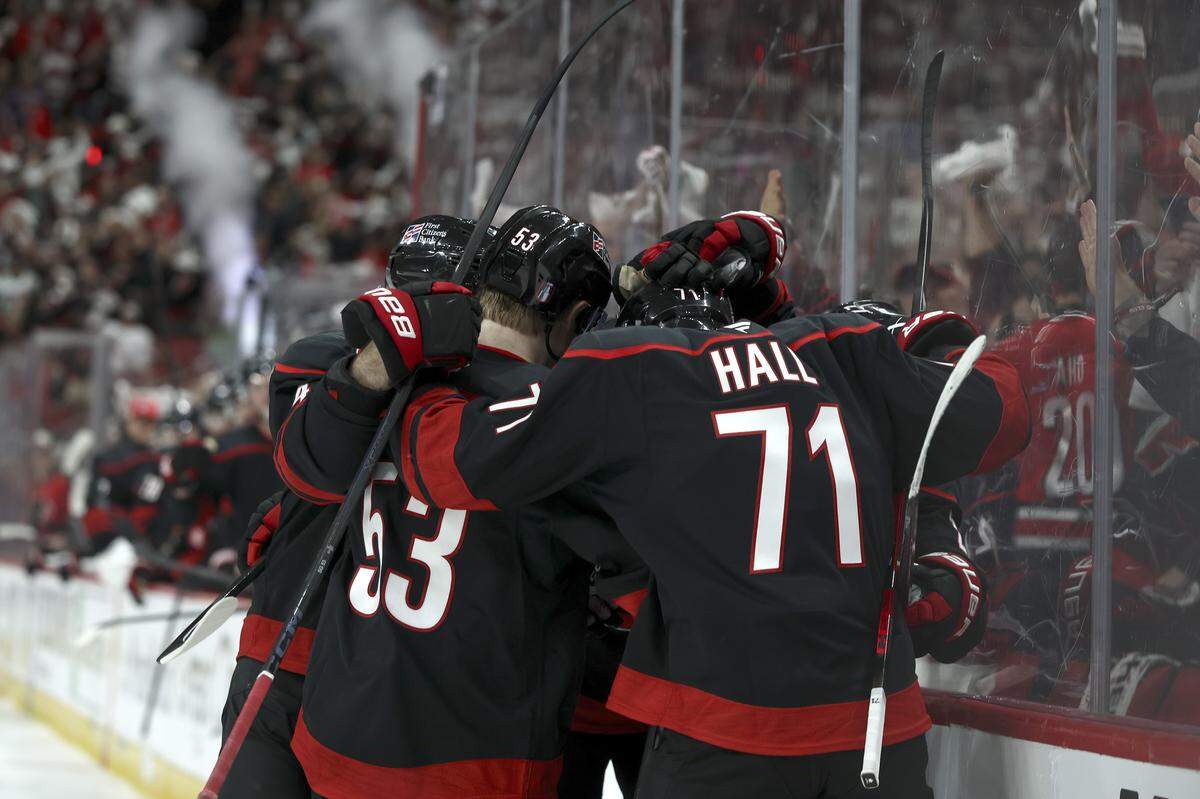 RALEIGH, NORTH CAROLINA - APRIL 18: The Carolina Hurricanes celebrate a goal scored by Logan Stankoven #22 during the second period of the game against the Ottawa Senators at Lenovo Center on April 18, 2026 in Raleigh, North Carolina.  (Photo by Jared C. Tilton/Getty Images)