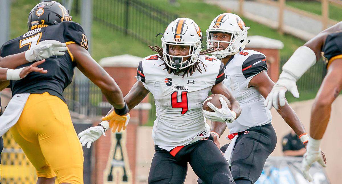 Campbell running back Bryant Barr (4) tries to pick his way through the Appalachian State defense on Sept. 25. The Camels lost, 52-21.