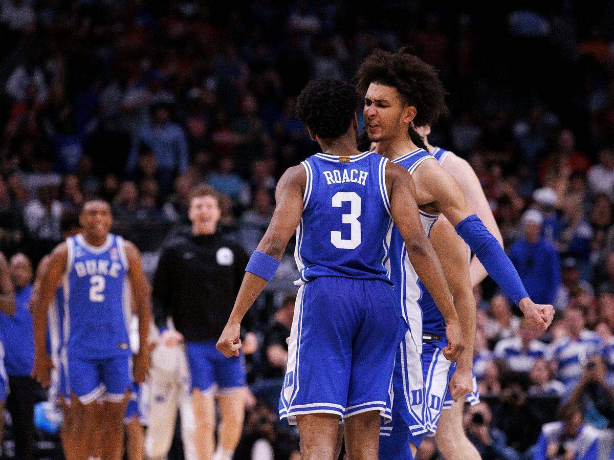 Duke’s Jeremy Roach and Tyrese Proctor celebrate late in the second half of the Blue Devils’ 54-51 win over Houston in the NCAA Tournament Sweet 16 on Friday, March 29, 2024, at American Airlines Center in Dallas, Texas.