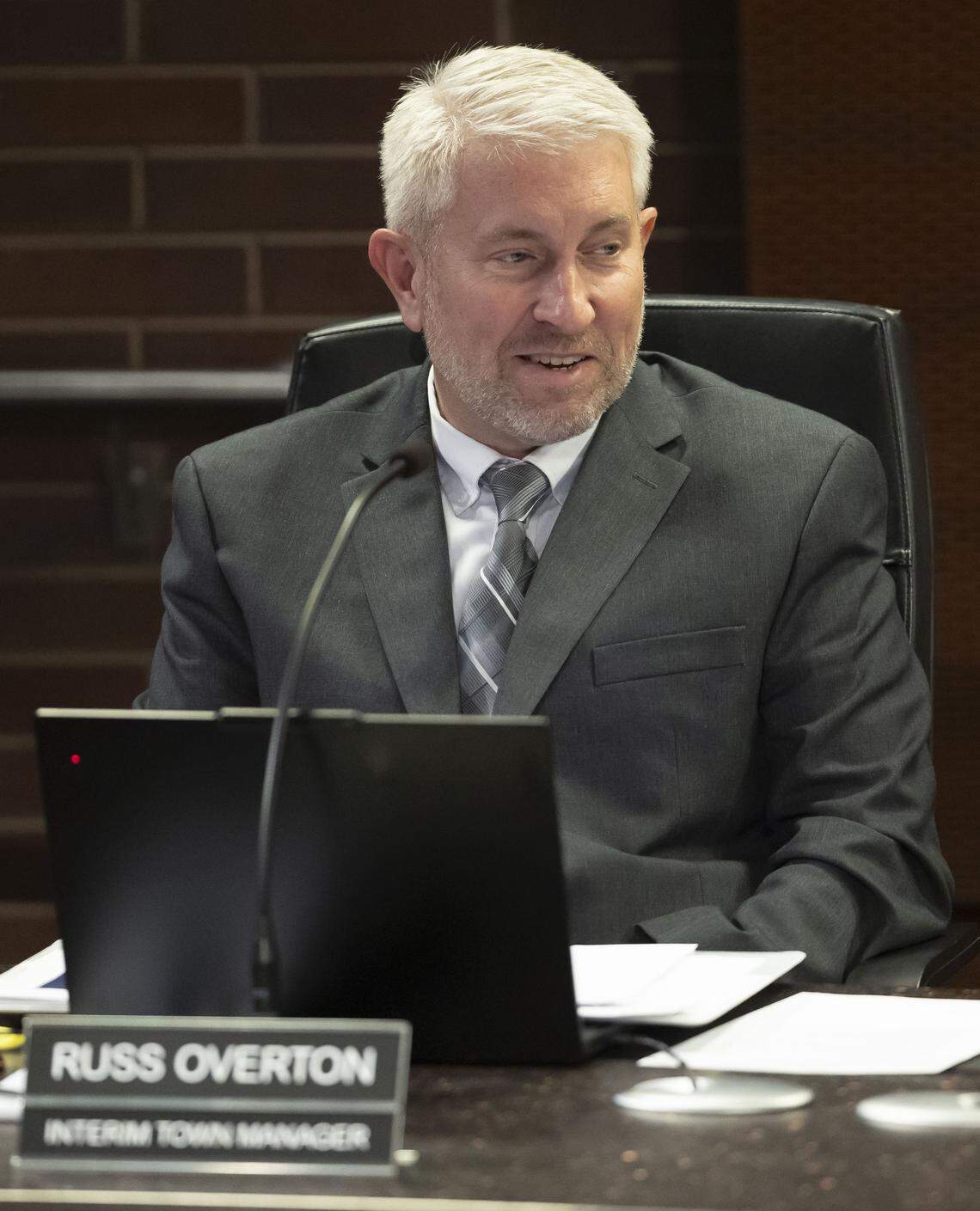 Interim Cary Town Manager Russ Overton listens during the town council meeting on Jan. 22, 2026 in Cary, N.C.
