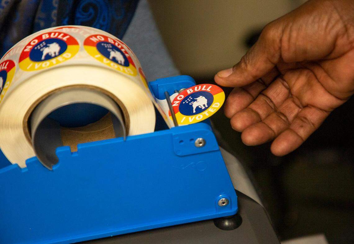 Kenneth Keith takes a sticker after casting his ballot on Election Day, Nov. 3, 2020, in Durham, N.C. in this file photo. Unaffiliated voters are about to pass registered Democrats as the largest voting group in North Carolina in 2022.