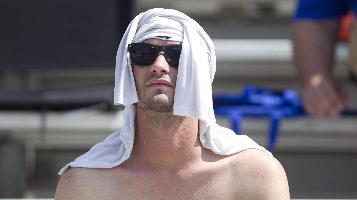 A fan uses his shirt to beat the heat during the final scrimmage and Fan Appreciation Day held at Alberstons Stadium in Boise.  Saturday Aug. 26, 2017.