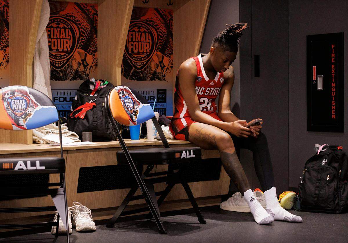 N.C. State’s Saniya Rivers sits in the locker room following the Wolfpack’s 78-59 Final Four loss to South Carolina at Rocket Mortgage FieldHouse on Friday, April 5, 2024, in Cleveland, Ohio.