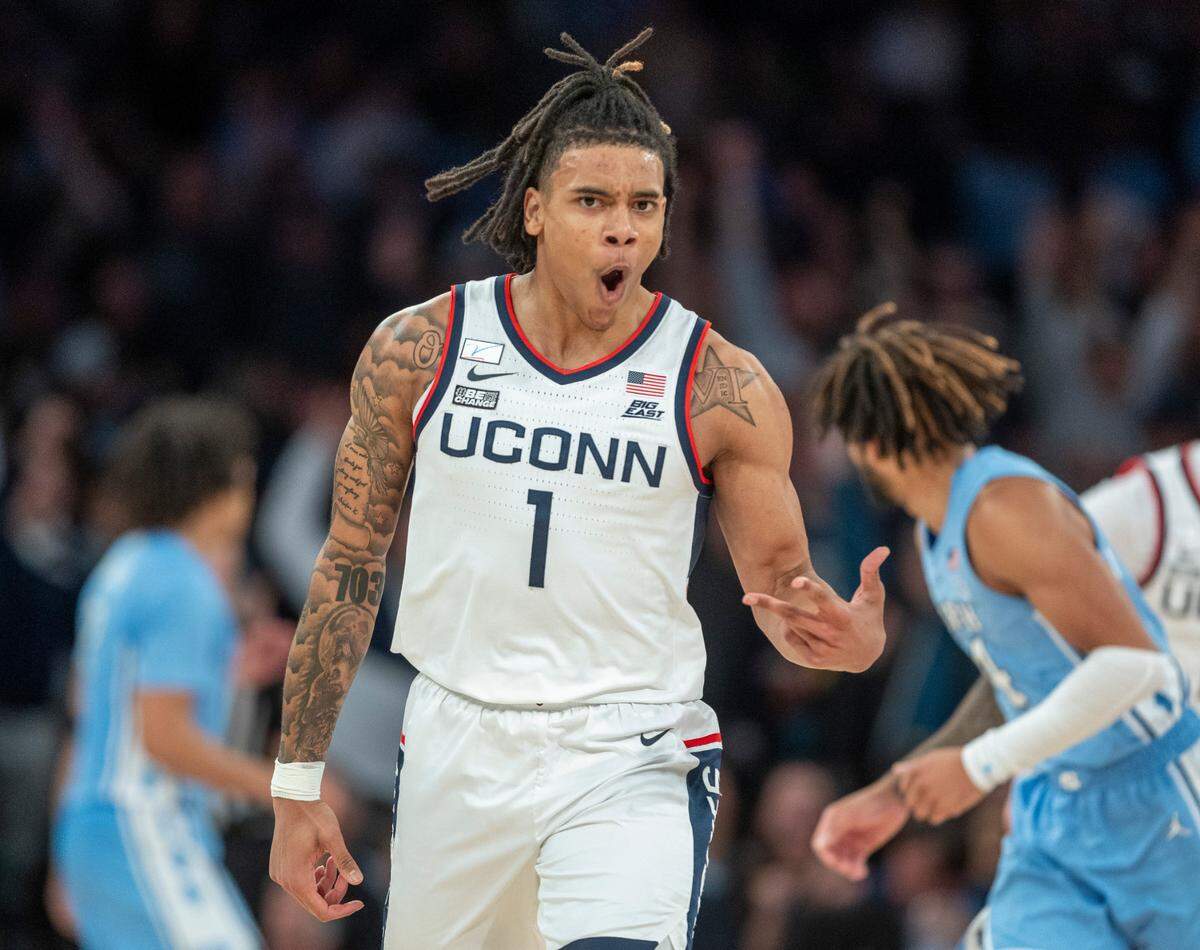 Connecticut’s Solomon Ball (1) reacts after sinking a three-point basket to take a 58-45 lead over North Carolina during the second half in the Jimmy V Classic on Tuesday, December 5, 2023 at Madison Square Garden in New York, NY.