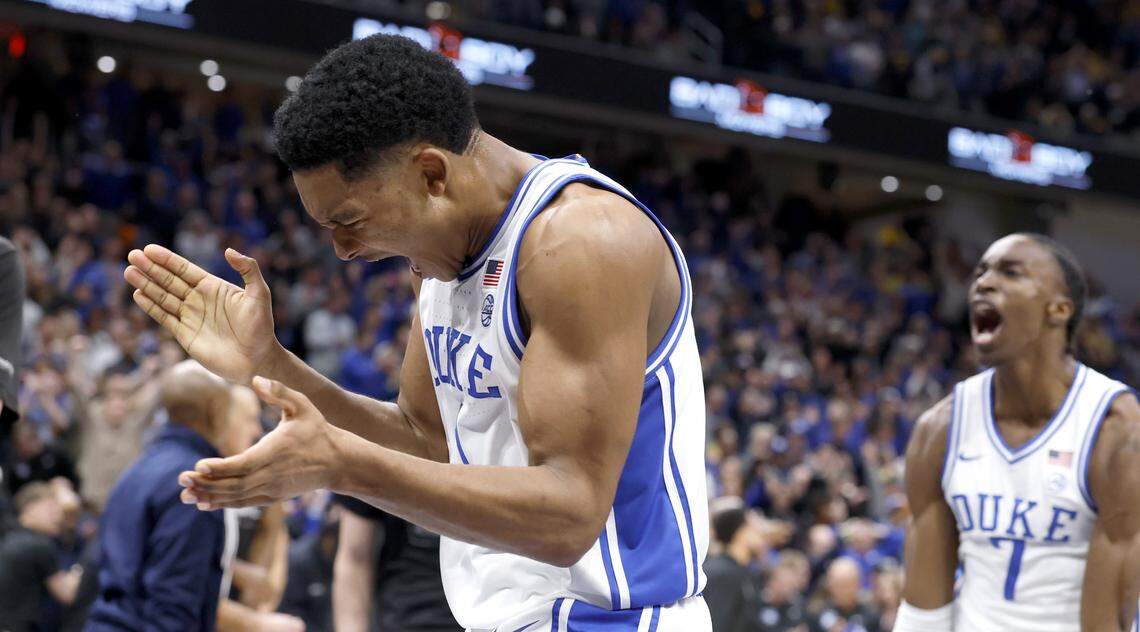 Duke’s Caleb Foster (1) and Dame Sarr (7) celebrate after Duke’s 68-63 victory over Michigan in the Capital Showcase at Capital One Arena in Washington, D.C., Saturday, Feb. 21, 2026.