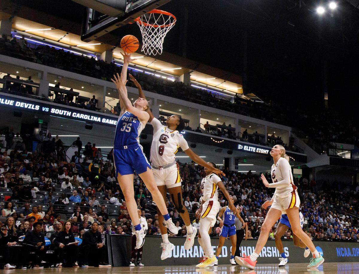 Duke’s Toby Fournier drives to the basket past South Carolina’s Joyce Edwards during the first half of the Blue Devils’ NCAA Tournament Elite Eight matchup at Legacy Arena on Sunday, March 30, 2025, in Birmingham, Ala.