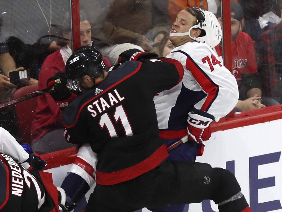 Carolina’s Jordan Staal (11) hits Washington’s John Carlson (74) during the second period of the Carolina Hurricanes’ game against the Washington Capitals at PNC Arena in Raleigh, N.C., Monday, April 15, 2019.