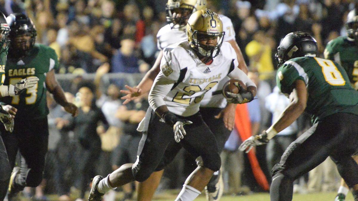 Trevion Cooley (23) of Knightdale moves the ball against John Wright (8) of Enloe. The Knightdale Knights visited the Enloe Eagles in a high school football game on September 20, 2019.