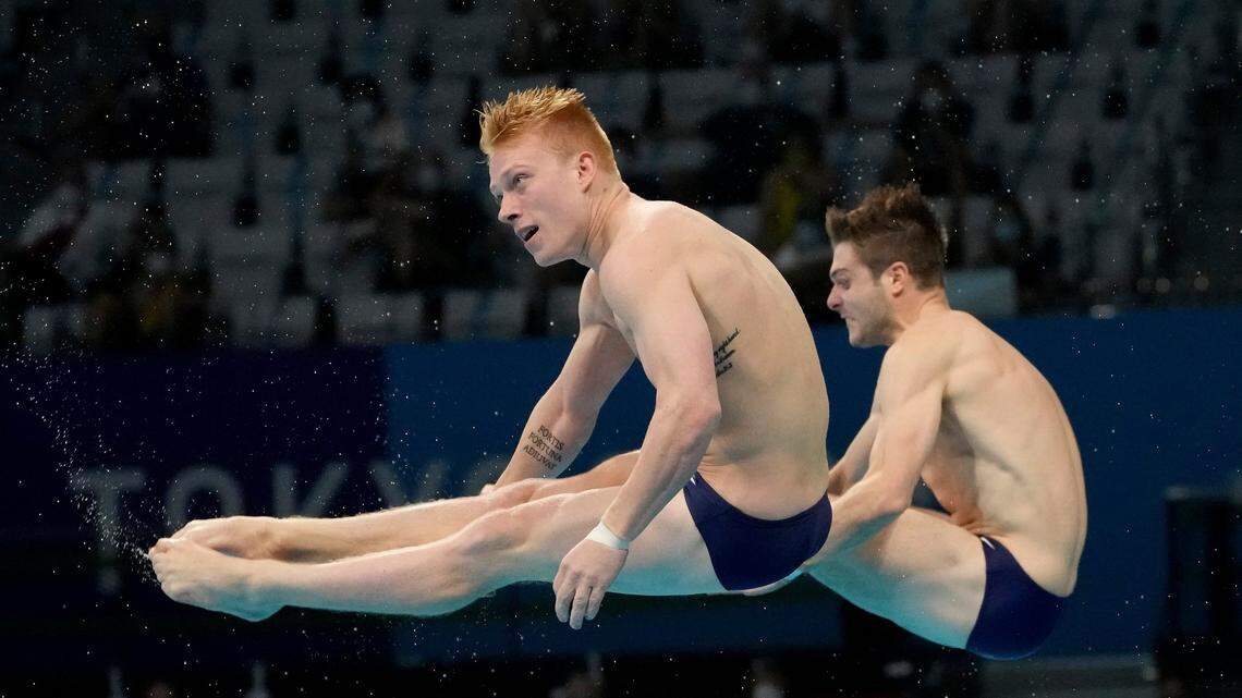 Andrew Capobianco and Michael Hixon of the United States’ compete during the men’s Synchronized 3m Springboard Final at the Tokyo Aquatics Centre at the 2020 Summer Olympics, Wednesday, July 28, 2021, in Tokyo, Japan. (AP Photo/Dmitri Lovetsky)